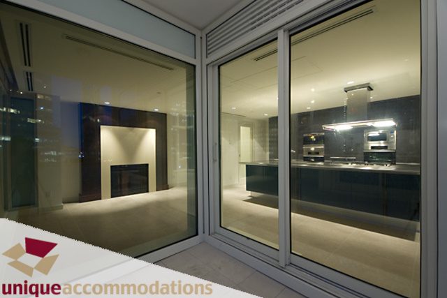 Modern kitchen with sleek countertops and city view. - 903 - 1139 West Cordova Street, Vancouver Downtown