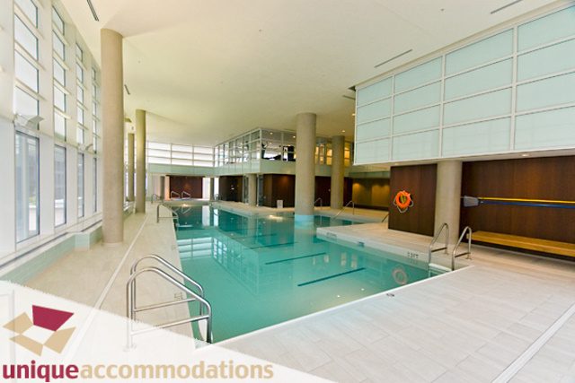 Spacious living room with modern furnishings and large windows. - 903 - 1139 West Cordova Street, Vancouver Downtown