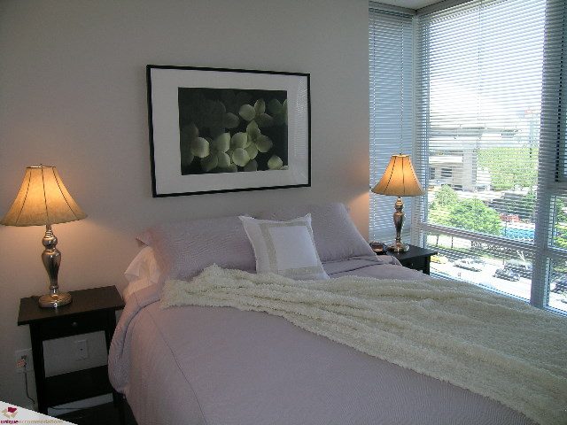 Bright bedroom with city view and two lamps. - 902 - 928 Beatty Street, Vancouver Downtown