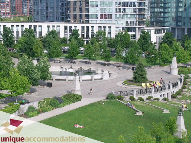 Furnished living room with city view and greenery. - 1001- 633 Kinghorne Mews, Vancouver Downtown