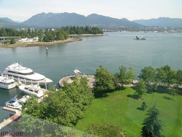Bright living room with stunning city view and waterfront access. - 802 - 323 Jervis Street, Vancouver Downtown