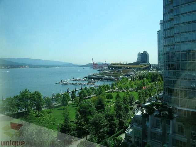 Bright living room with stunning city view and modern furnishings. - 802 - 323 Jervis Street, Vancouver Downtown