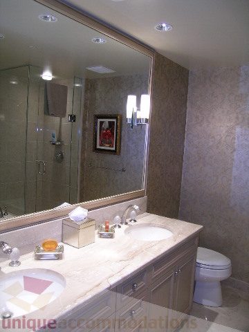 Bathroom with marble countertop, modern fixtures, and large mirror. - 802 - 323 Jervis Street, Vancouver Downtown