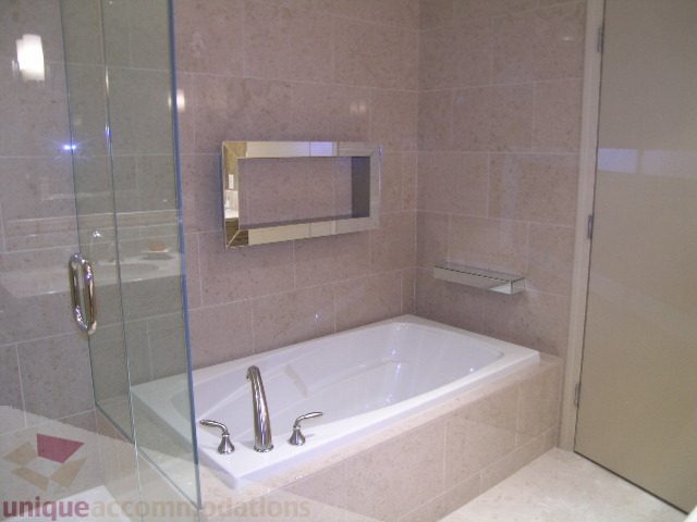 Bright bathroom with modern fixtures and glass shower enclosure. - 802 - 323 Jervis Street, Vancouver Downtown