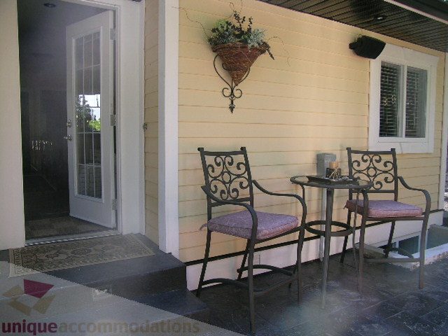 Furnished patio with wrought iron furniture and hanging plant basket. - 4104 Sunnycrest drive, North Vancouver