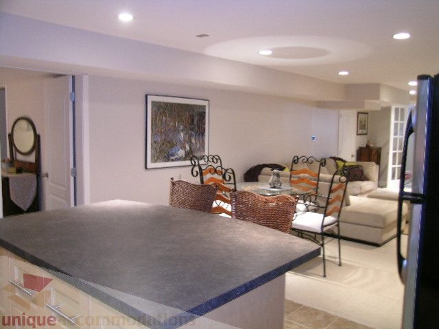 Furnished living room with modern furniture and a large painting on the wall. - 4104 Sunnycrest drive, North Vancouver