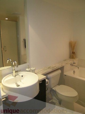 Bathroom with dual sinks, modern fixtures, and a clean, minimalist design. - 705 - 1055 Homer Street, Vancouver Downtown