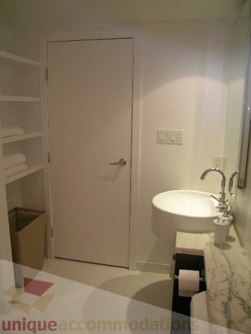 Furnished bathroom with marble countertop and modern fixtures. - 705 - 1055 Homer Street, Vancouver Downtown