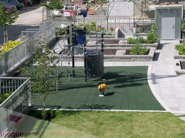 Furnished 1-bedroom balcony with green turf, garden beds, and urban views. - 208 - 1833 Crowe St., Vancouver West Side