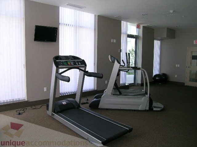 Bright gym with treadmills and large windows, natural light, no people. - 208 - 1833 Crowe St., Vancouver West Side