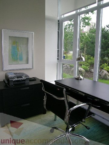 Furnished office space with large windows, desk, and modern chair. - 102 - 1333 West 11th Ave., Vancouver West Side
