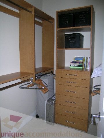 Furnished bedroom with built-in closet and desk, light wood finish. - 102 - 1333 West 11th Ave., Vancouver West Side