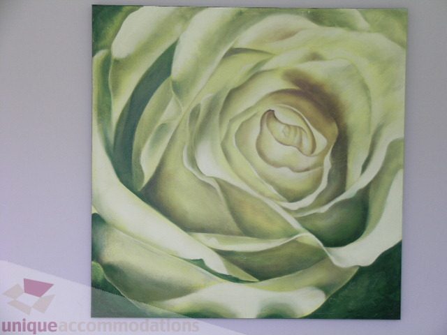 Framed artwork of a green-toned rose adorns the wall. - 102 - 1333 West 11th Ave., Vancouver West Side