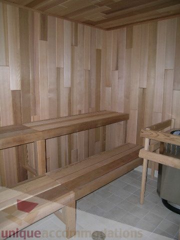 Spacious sauna with wooden benches and tiled floor, perfect for relaxation. - 1209 - 1055 Richards Street, Vancouver Downtown
