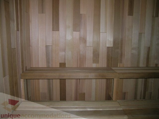 Spacious living room with unique wood paneling and modern decor. - 1209 - 1055 Richards Street, Vancouver Downtown