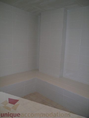 Modern bathroom with white tiled walls and countertop, ready for move-in. - 1209 - 1055 Richards Street, Vancouver Downtown