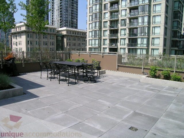 Spacious rooftop patio with modern furniture and city views. - 1209 - 1055 Richards Street, Vancouver Downtown