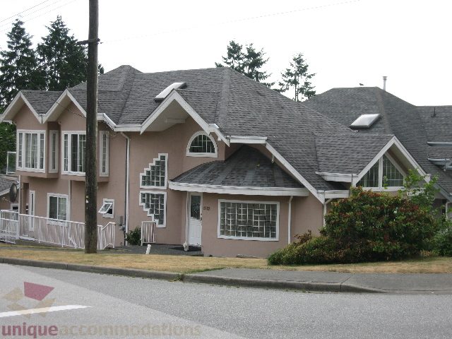 Spacious 4-bedroom house with unique architectural design and large windows. - 2737 Mahon Ave., North Vancouver