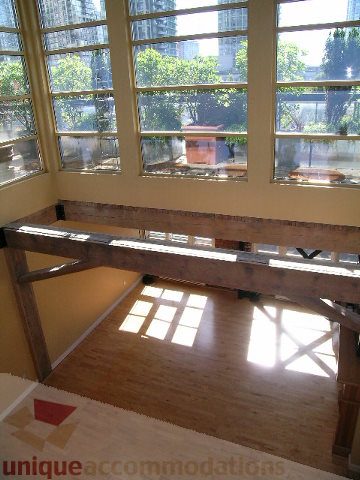 Bright dining area with large windows, hardwood floors, and city view. - 408 - 1066 Hamilton Street, Vancouver Downtown