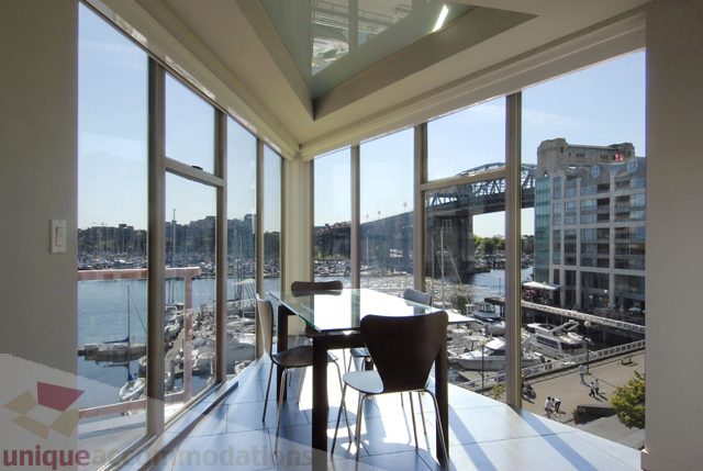 Bright living room with city view and waterfront access. - 310 - 990 Beach, Vancouver Downtown