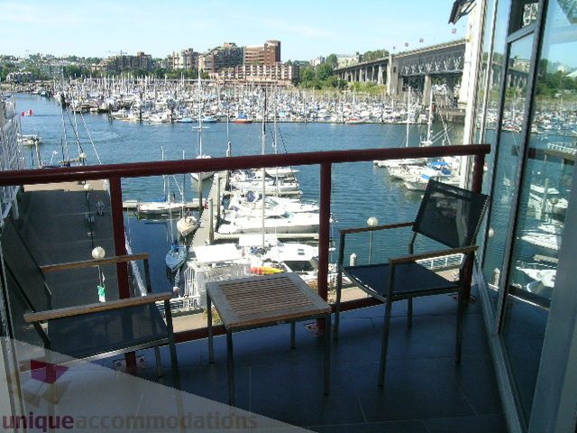 Furnished balcony with city view and harbor boats. - 310 - 990 Beach, Vancouver Downtown