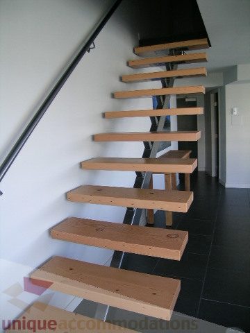 Bright staircase with wooden steps and modern design. - 310 - 990 Beach, Vancouver Downtown