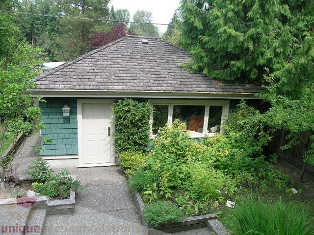 Furnished 3-bedroom + den house with a cozy front porch and lush greenery. - 4035 West 27th Avenue, Vancouver West Side