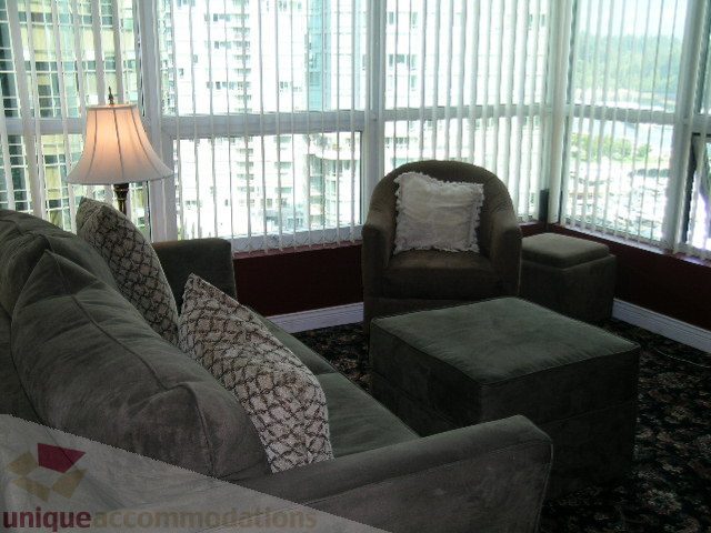Furnished living room with plush seating and city view. - 1403 - 555 Jervis Street, Vancouver Downtown