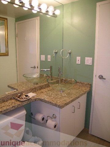 Furnished bathroom with granite countertops and a large mirror. - 1403 - 555 Jervis Street, Vancouver Downtown