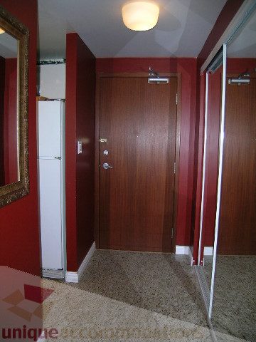 Furnished hallway with red walls, wooden doors, and carpeted floor. - 1403 - 555 Jervis Street, Vancouver Downtown