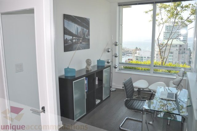 Furnished living room with city view and modern decor. - 2702 - 638 Beach Crescent, Vancouver Downtown