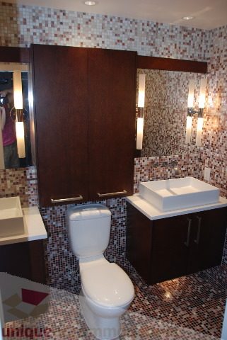 Furnished bathroom with mosaic tile walls and dual sink vanity. - 2702 - 638 Beach Crescent, Vancouver Downtown