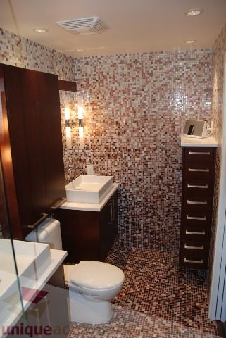 Furnished bathroom with mosaic tile walls and a modern sink. - 2702 - 638 Beach Crescent, Vancouver Downtown