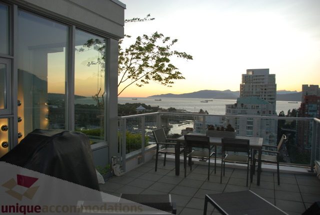 Bright living room with city view and modern furnishings. - 2702 - 638 Beach Crescent, Vancouver Downtown