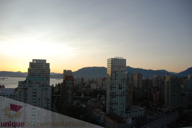 Bright living room with city view and modern furnishings. - 2702 - 638 Beach Crescent, Vancouver Downtown