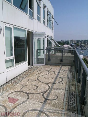 Furnished balcony with mosaic tile flooring and city view. - 603 - 1383 Marinaside Crescent, Vancouver Downtown