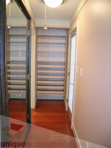 Bright hallway with sliding closet doors and hardwood floors. - 603 - 1383 Marinaside Crescent, Vancouver Downtown