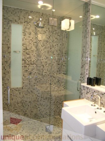 Furnished bathroom with mosaic tile walls, modern sink, and glass shower. - 902 - 528 Beatty Street, Vancouver Downtown