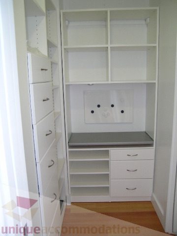 Bright walk-in closet with white shelves and drawers, hardwood floors. - 902 - 528 Beatty Street, Vancouver Downtown