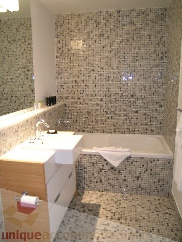 Bright bathroom with mosaic tile walls and modern fixtures. - 902 - 528 Beatty Street, Vancouver Downtown