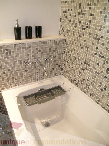 Bright bathroom with mosaic tile walls and modern fixtures. - 902 - 528 Beatty Street, Vancouver Downtown