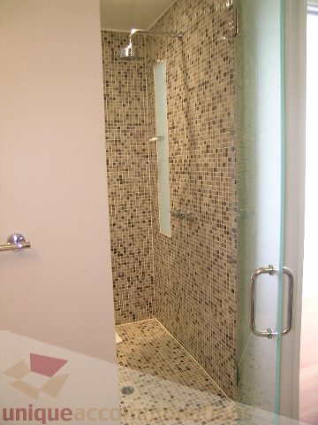 Bright bathroom with mosaic tile walls and glass shower door. - 902 - 528 Beatty Street, Vancouver Downtown