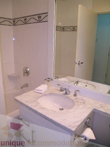 Bathroom with marble countertop and modern fixtures. - 3802 - 1189 Melville Street, Vancouver Downtown