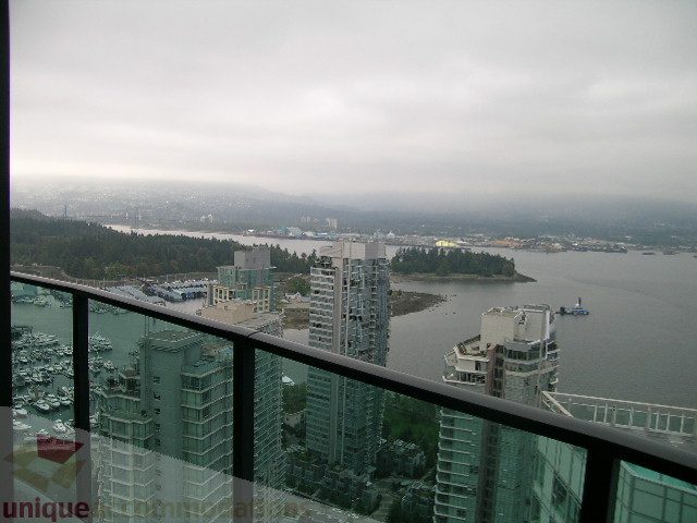 Bright living room with stunning city view and modern furnishings. - 3802 - 1189 Melville Street, Vancouver Downtown