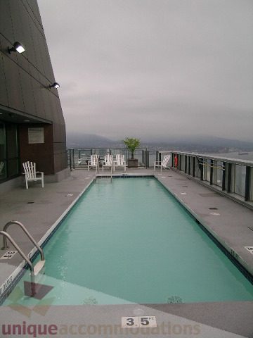 Spacious rooftop terrace with a stunning city view and a refreshing swimming pool. - 3802 - 1189 Melville Street, Vancouver Downtown