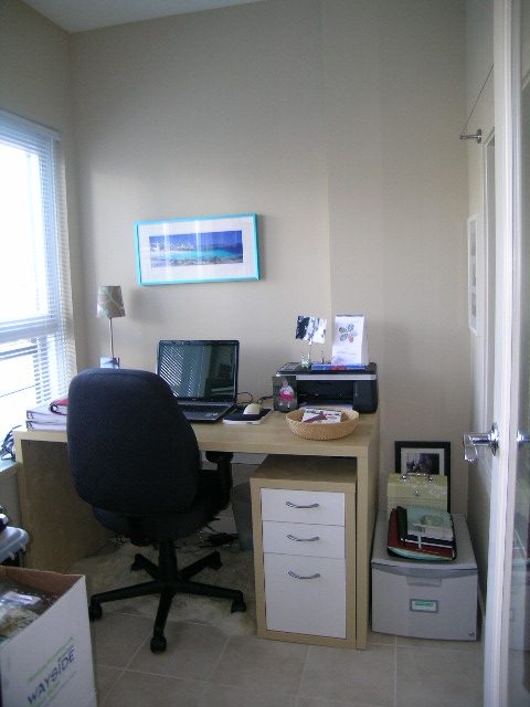 Compact home office with desk, chair, and filing cabinet. - 315 - 4078 Knight Street, Vancouver West Side