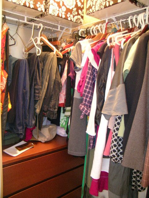 Closet with neatly organized clothes and hangers. - 315 - 4078 Knight Street, Vancouver West Side