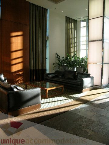 Furnished living room with large windows, natural light, and modern furniture. - 2401 - 1005 Beach Avenue, Vancouver Downtown