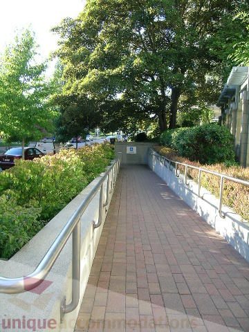 Furnished patio with brick flooring and greenery. - 2401 - 1005 Beach Avenue, Vancouver Downtown