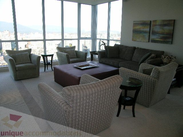 Furnished living room with city view and modern decor. - 4303 - 1408 Strathmore Mews, Vancouver Downtown